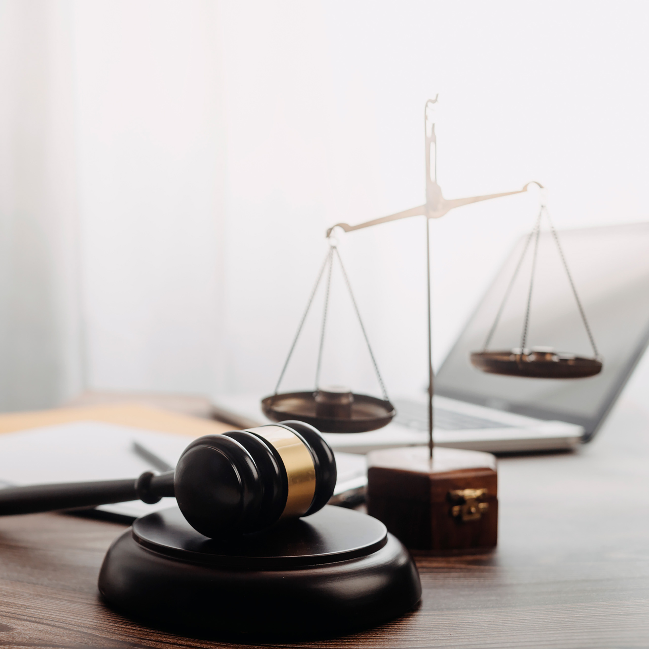 Desk with justice scale and laptop