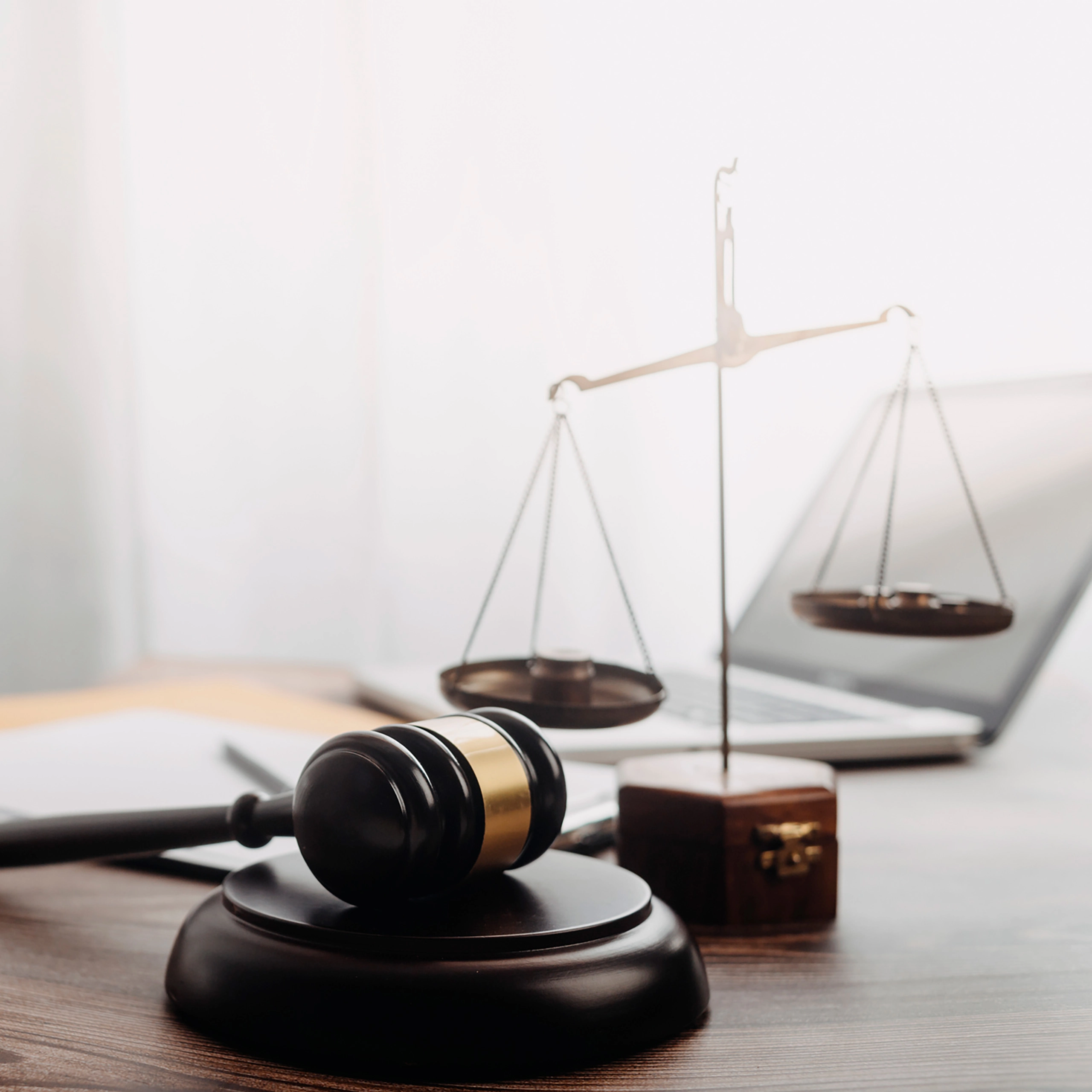 Desk with justice scale and laptop