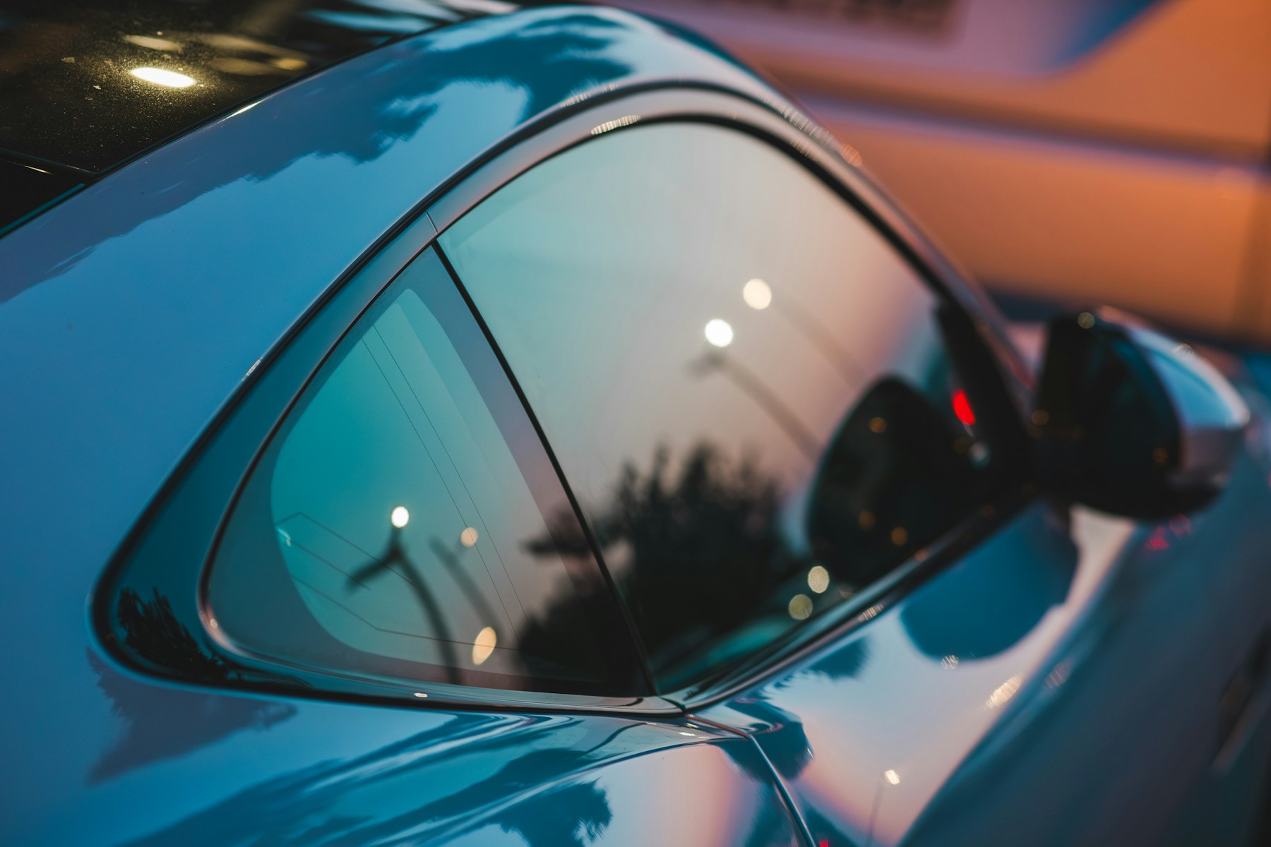 Tinted rear side window on a car.