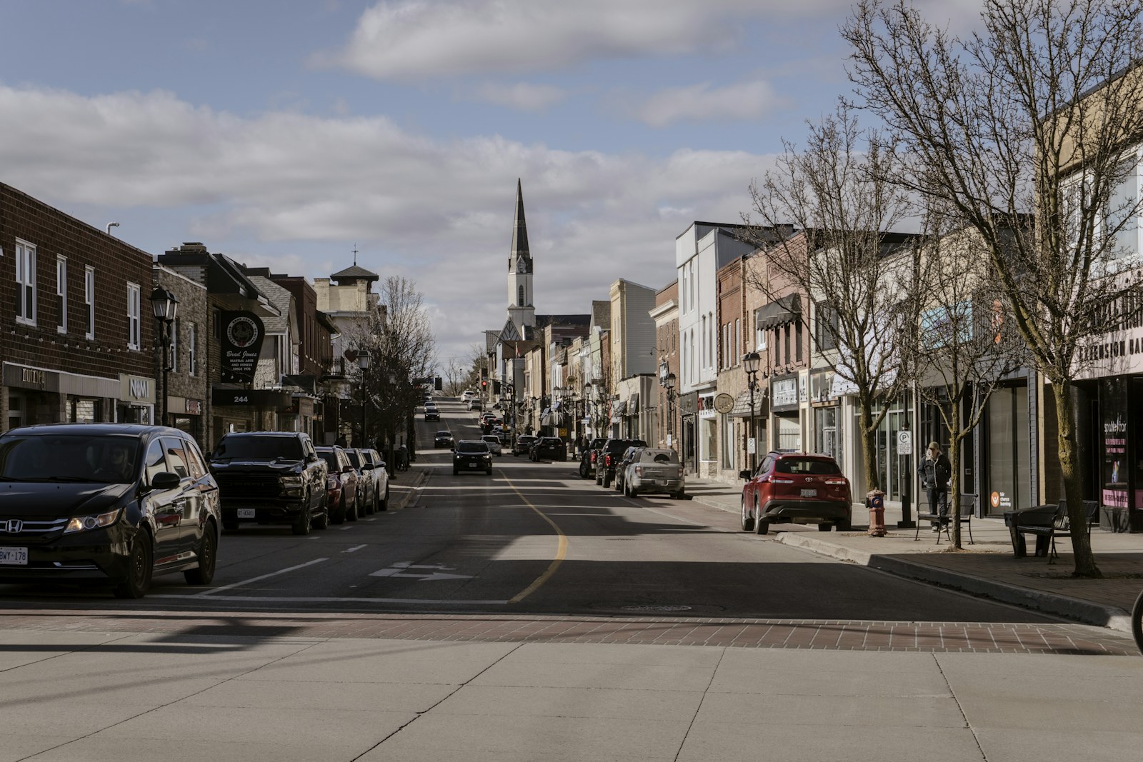 Shops and traffic along Main Street in Newmarket.