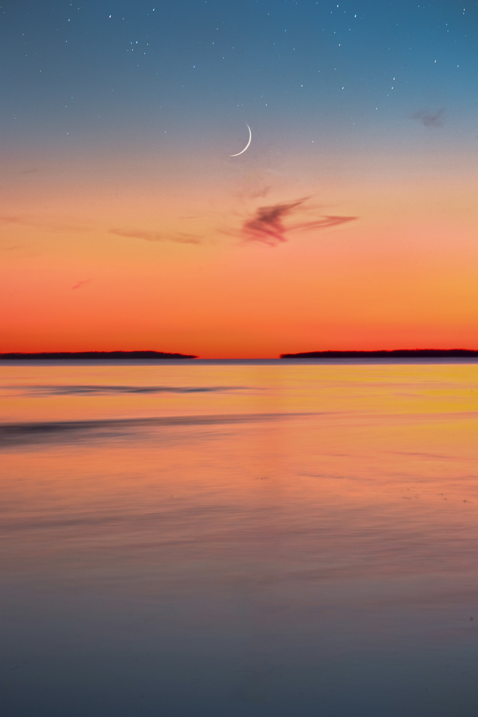 A crescent moon over Lake Nipissing at North Bay.